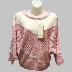 Pink and white colorblocked dolman sleeve sweater.